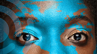 Face painted with blue world map