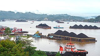 Transporting coal by ship in India.