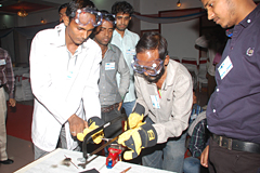 Group of people around workbench